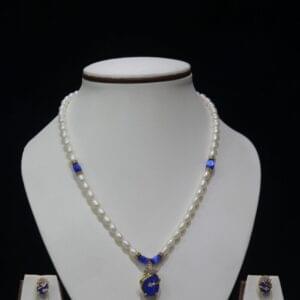 Pearl and Blue Stone Necklace Set - A graceful necklace featuring luminous pearls and radiant blue stone accents, paired with matching earrings for timeless elegance.