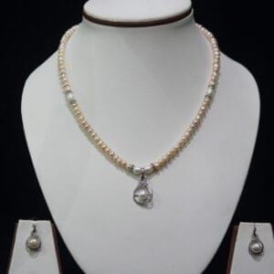Pearl Necklace Set with Heart-Shaped Pendant - A stunning pearl necklace set featuring a delicate heart-shaped pendant, symbolizing love and elegance.