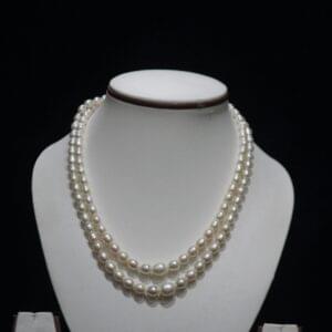 Two-Layered Pearl Necklace Set - A chic and elegant two-layer pearl necklace set, perfect for elevating your style with its graceful, layered design.