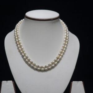 Two-Layered Pearl Necklace Set - A sophisticated two-layer pearl necklace set that combines timeless elegance with modern design for any special occasion.