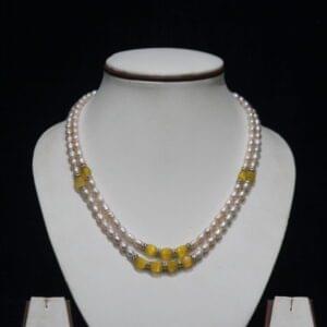 Pearl Necklace Set with Yellow Stone Accents - A refined and elegant pearl necklace set featuring vibrant yellow stone accents, perfect for adding a touch of color to your look.