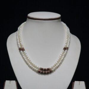 Pearl Necklace Set with Wooden Beads - A stylish combination of lustrous pearls and earthy wooden beads, creating a unique and fashionable necklace set.