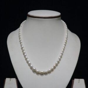 Unique Pearl Necklace - A one-of-a-kind pearl necklace featuring distinctively shaped pearls, offering a sophisticated and elegant design that stands out.