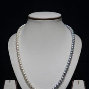 Two-Tone Pearl Necklace Set - A sophisticated jewelry set featuring a blend of light and dark pearls, offering a unique and modern twist on classic elegance.