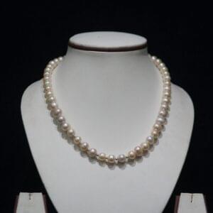 Pearl Necklace Set - A classic and elegant jewelry set featuring lustrous pearls, perfect for adding timeless sophistication to any outfit.