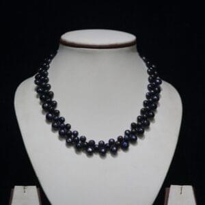 Black Pearl Necklace Set - A striking jewelry set featuring luminous black pearls paired with matching earrings, perfect for making a bold and elegant statement.