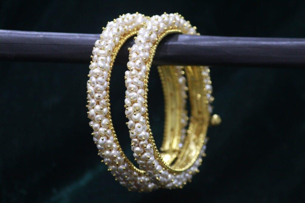 Classical pearl bangle set with elegant design.