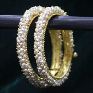 Classical pearl bangle set with elegant design.