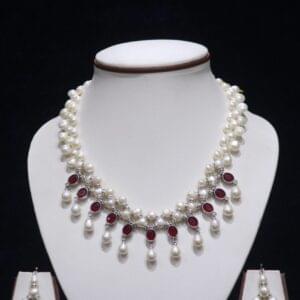 Pearl necklace set with ruby accents for a luxurious and elegant look.