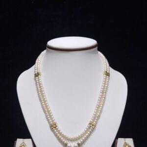 Stunning two-layered pearl necklace set with a beautiful pendant, perfect for adding elegance to any outfit.